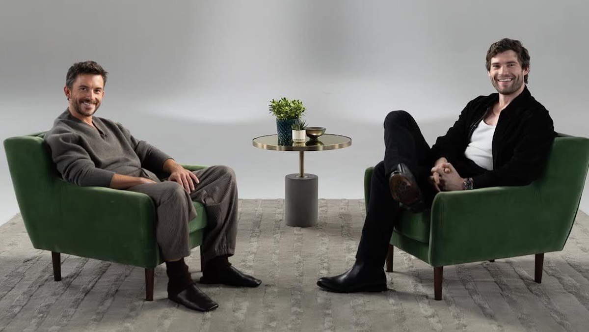 two men sitting across from each other