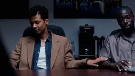 two men sitting at a table