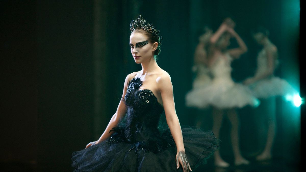 A ballet dancer in black moves on the stage in "Black Swan" 