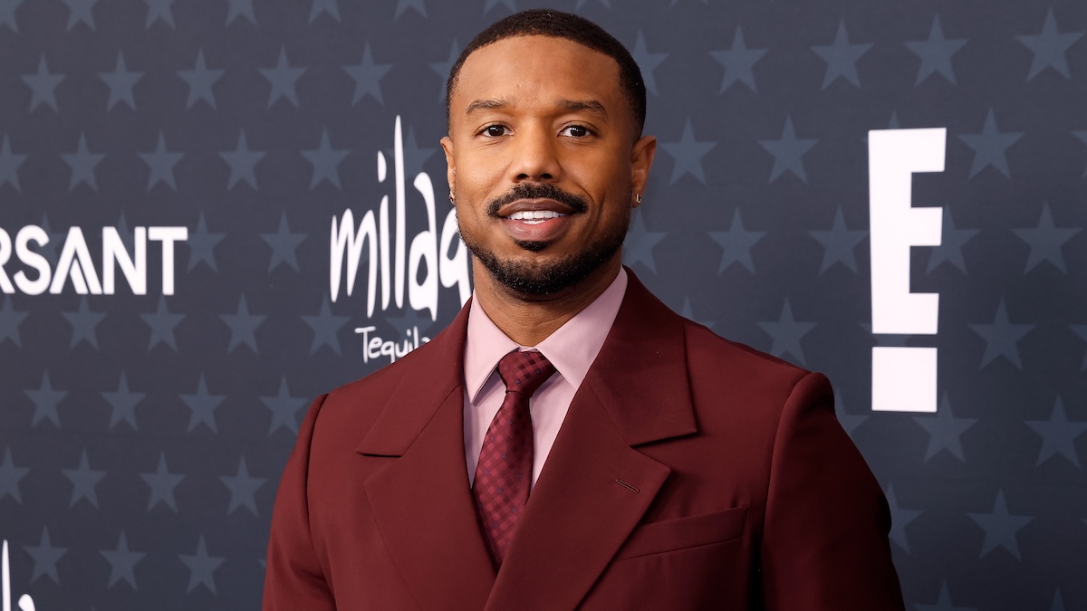 michael b jordan standing on a carpet