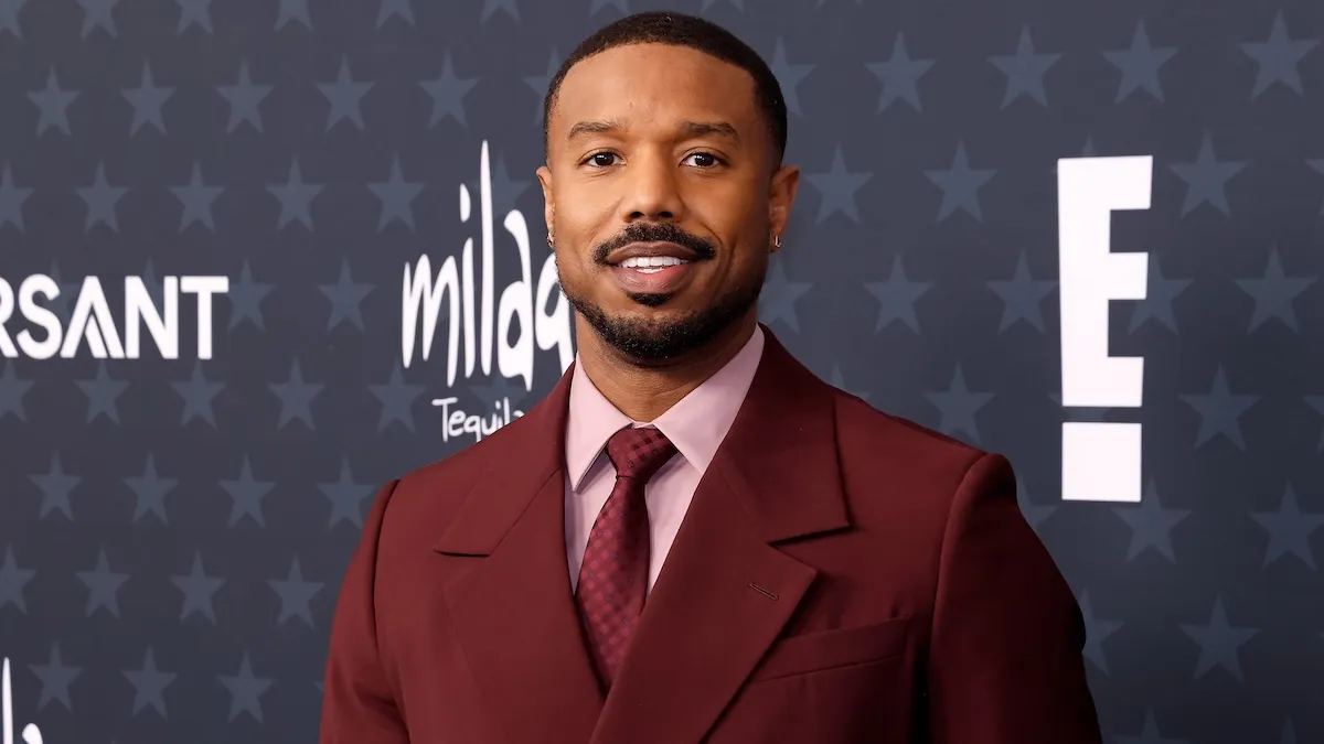 michael b jordan standing on a carpet