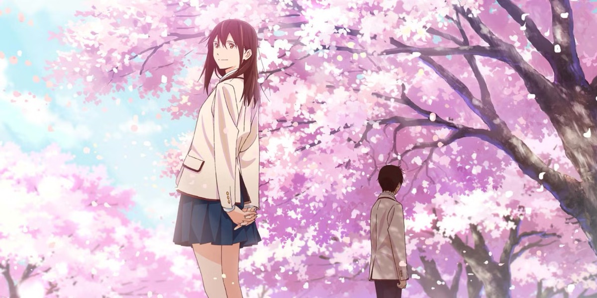 A boy and a girl stand on a path full of cherry blossoms in "I Want To Eat Your Pancreas" 