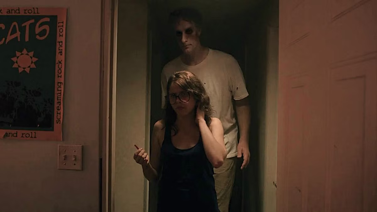 The Entity comes up behind a young woman in "It Follows"