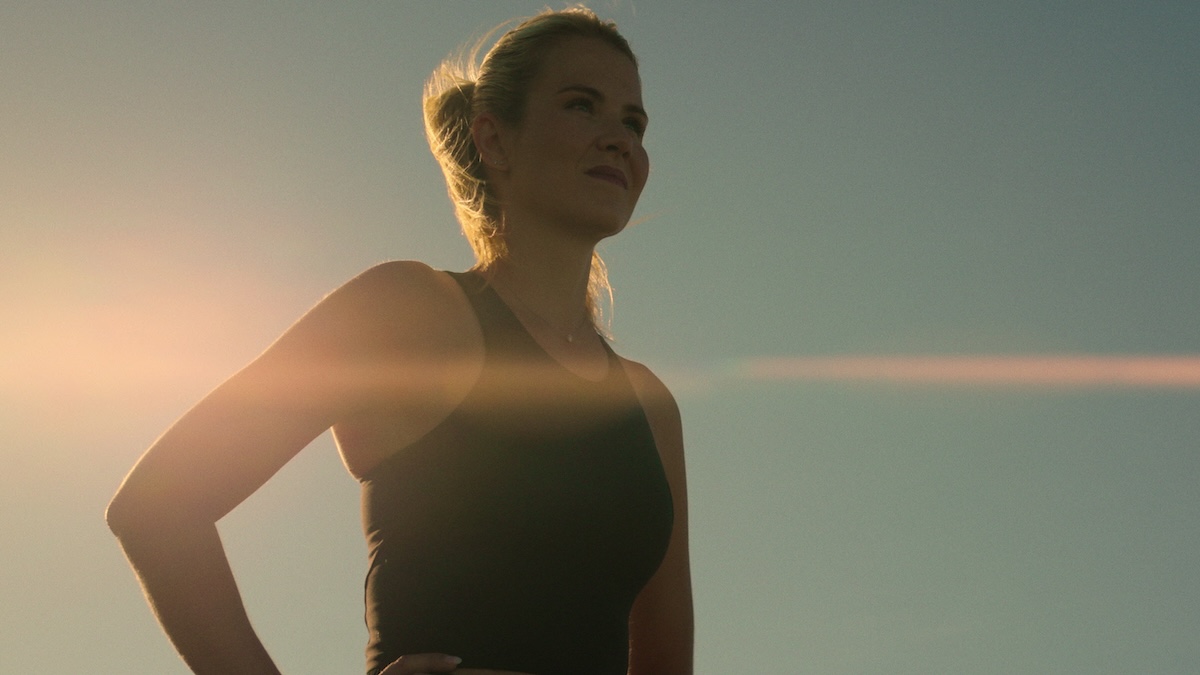 a woman standing in the sun