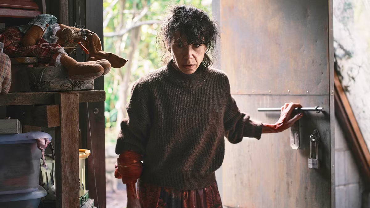 A dishevled woman stands in a doorway in "Bring Her Back"