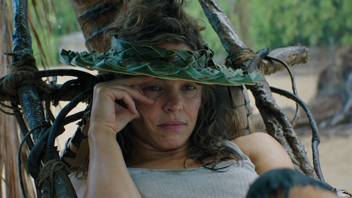 woman sitting with a hat on