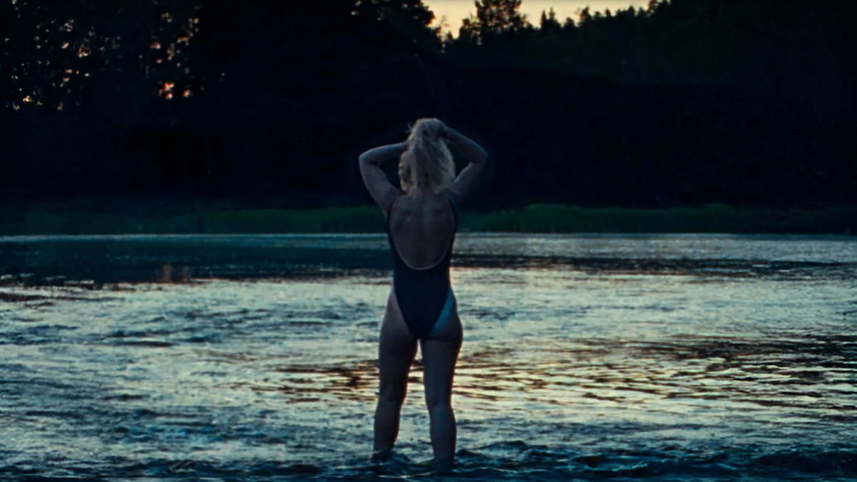 Imogen Poots stands by the water in The Chronology of Water