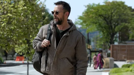 man walking with a backpack