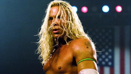 man standing with long hair