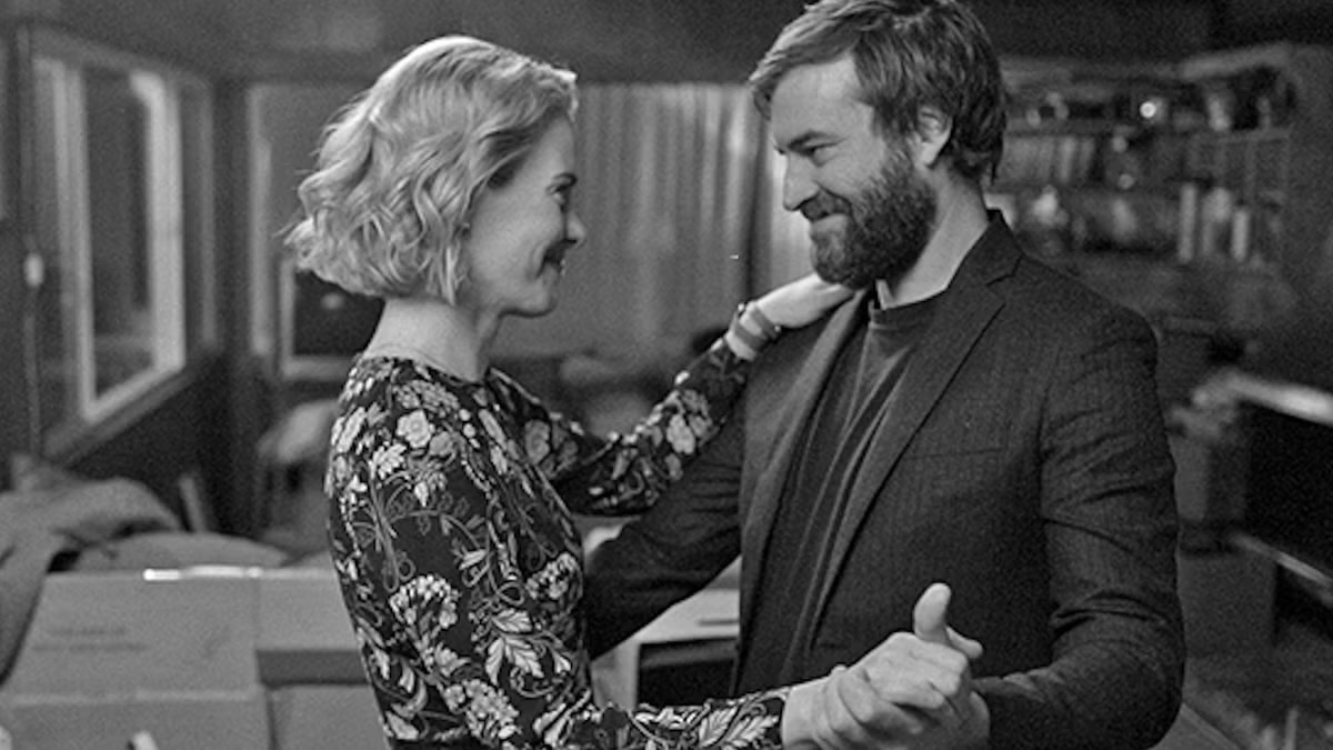 A couple smile and slowdance in "Blue Jay"