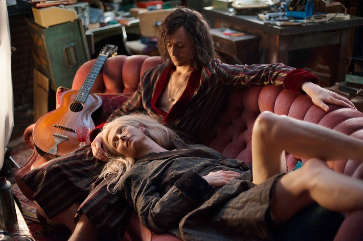 The vampire couple Adam and Eve cuddle on the sofa in "Only Lovers Left Alive" 