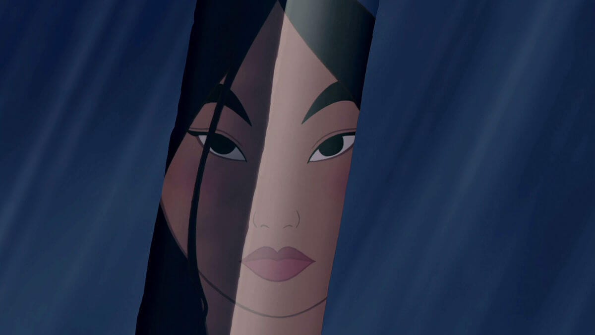 Mulan sees her face reflected in a sword in "Mulan" 