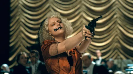 a woman holding a gun