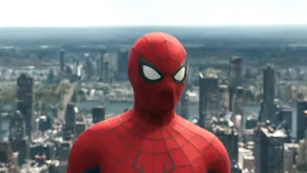 spider-man standing above the city