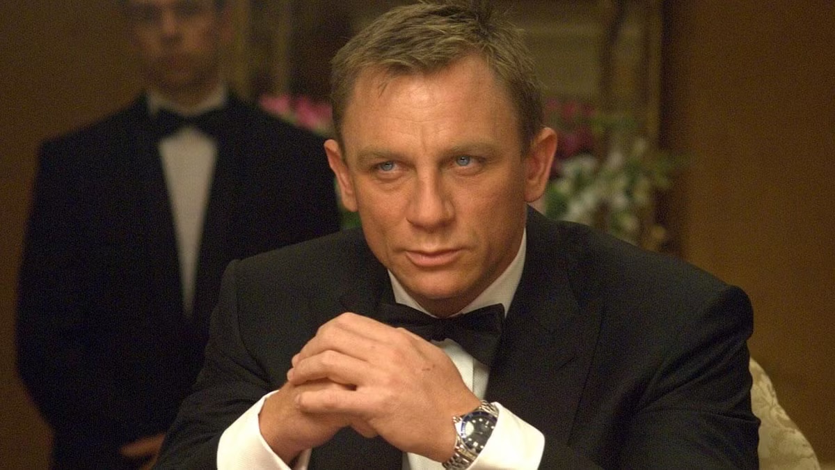 A debonair man stares intently across a card table in "Casino Royale"