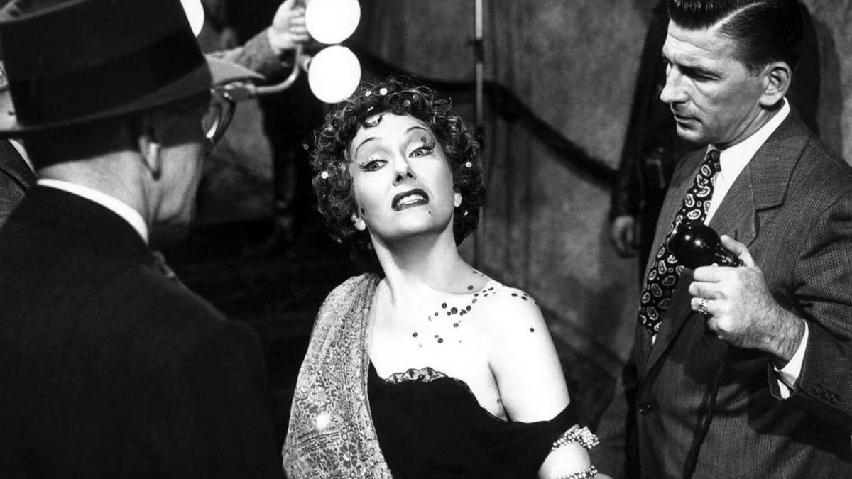 A glamorous older woman poses dramatically in "Sunset Boulevard"