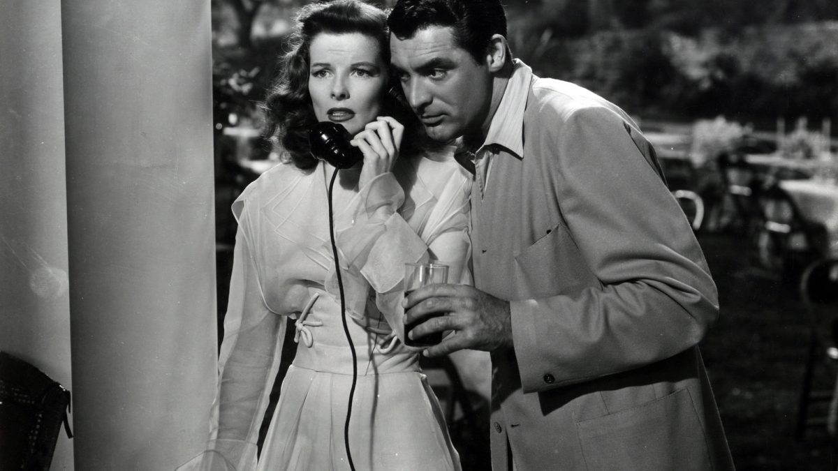 A woman axiously listens to a phonecall in "The Phildelphia Story"