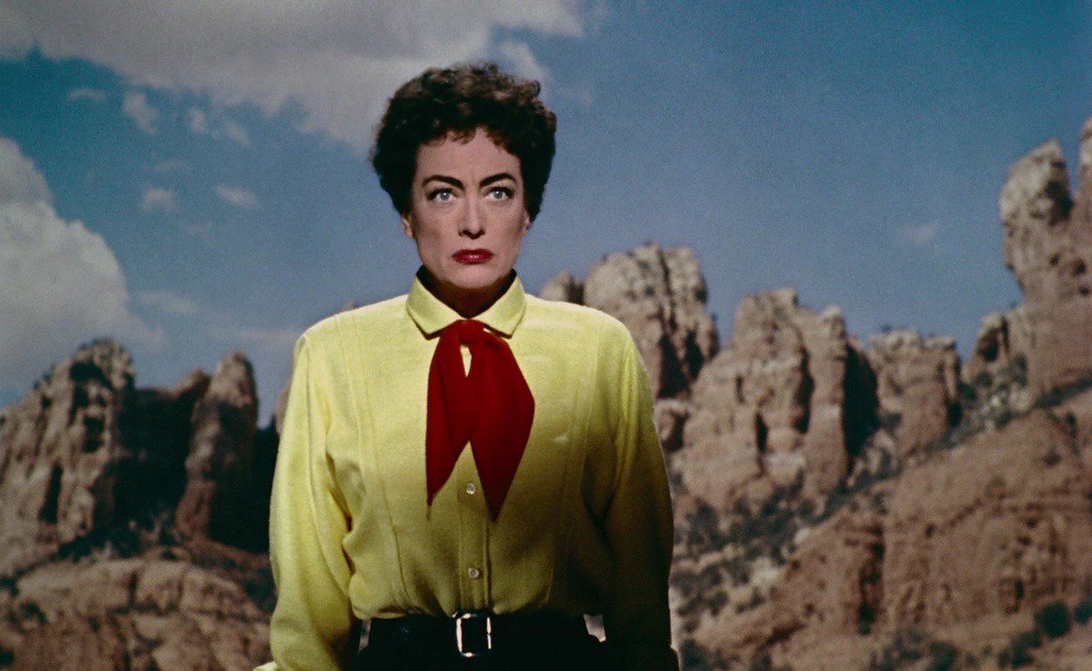 A woman in cowboy clothes stands in the desert in "Johnny Guitar"