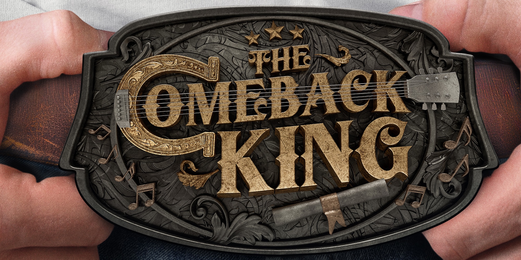 a belt buckle with two hands holding it