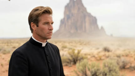 man standing by mountains