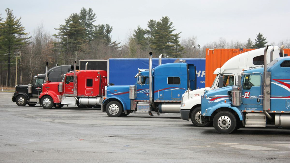 Colorful Semi Trucks Parked in Open Lot
