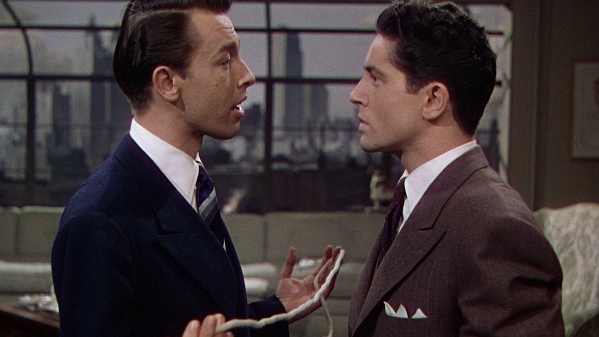 Two men stare intently at eachother in "Rope" 