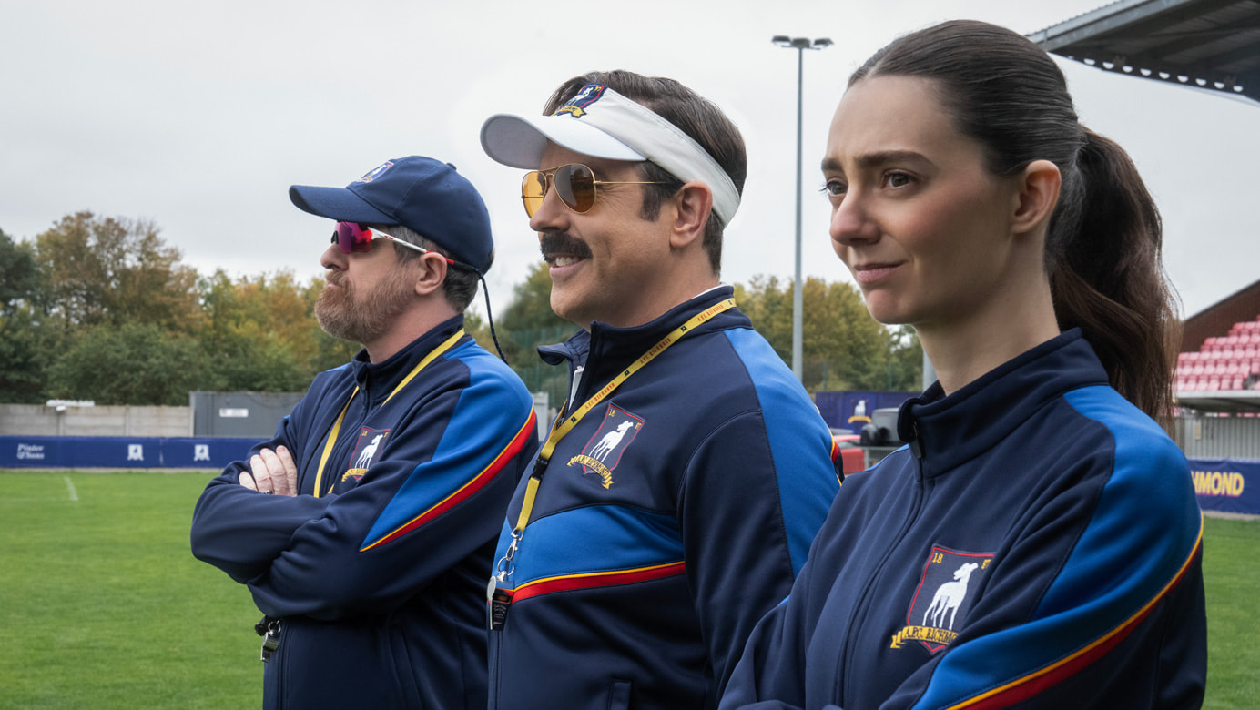 Brendan Hunt, Jason Sudeikis and Tanya Reynolds in “Ted Lasso” season four, premiering Wednesday, August 5 on Apple TV.
