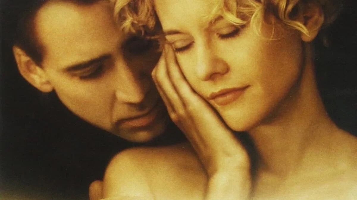 A man and woman lean on each other in the City of Angels remake