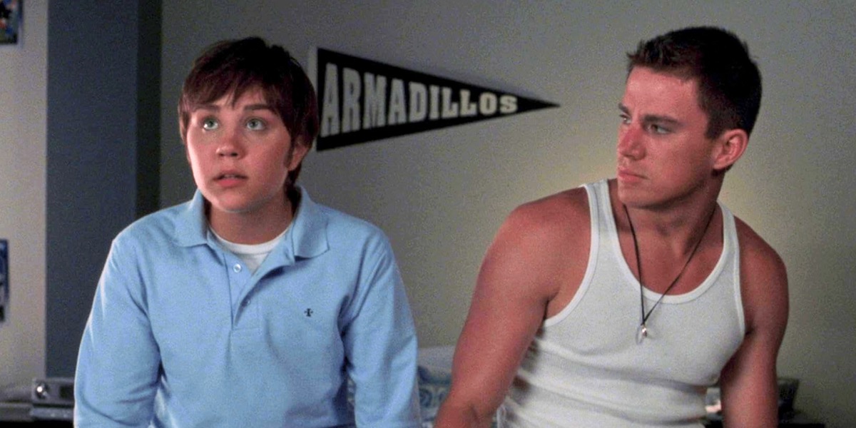 A man looks curiously at a man disguised at a man in She's the Man