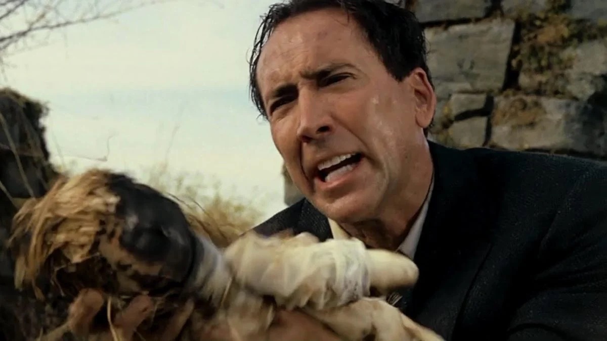 A man weeps and holds a doll in The Wicker Man