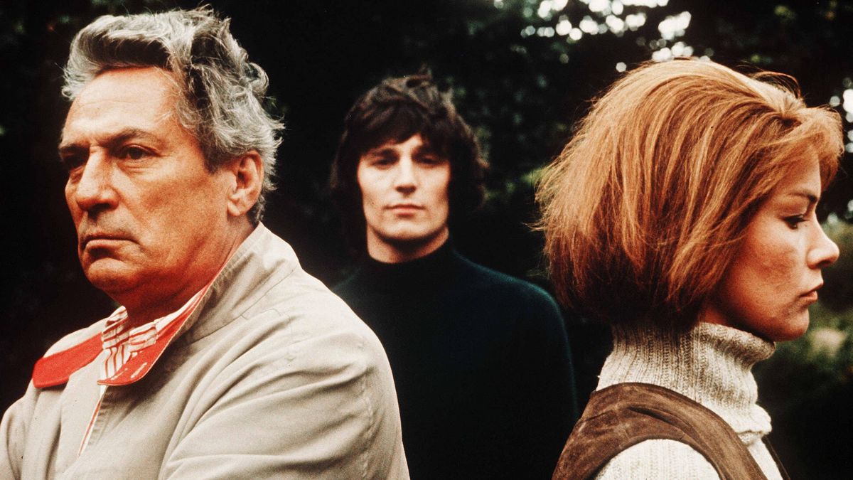 A throuple stand togehter in Sunday Bloody Sunday