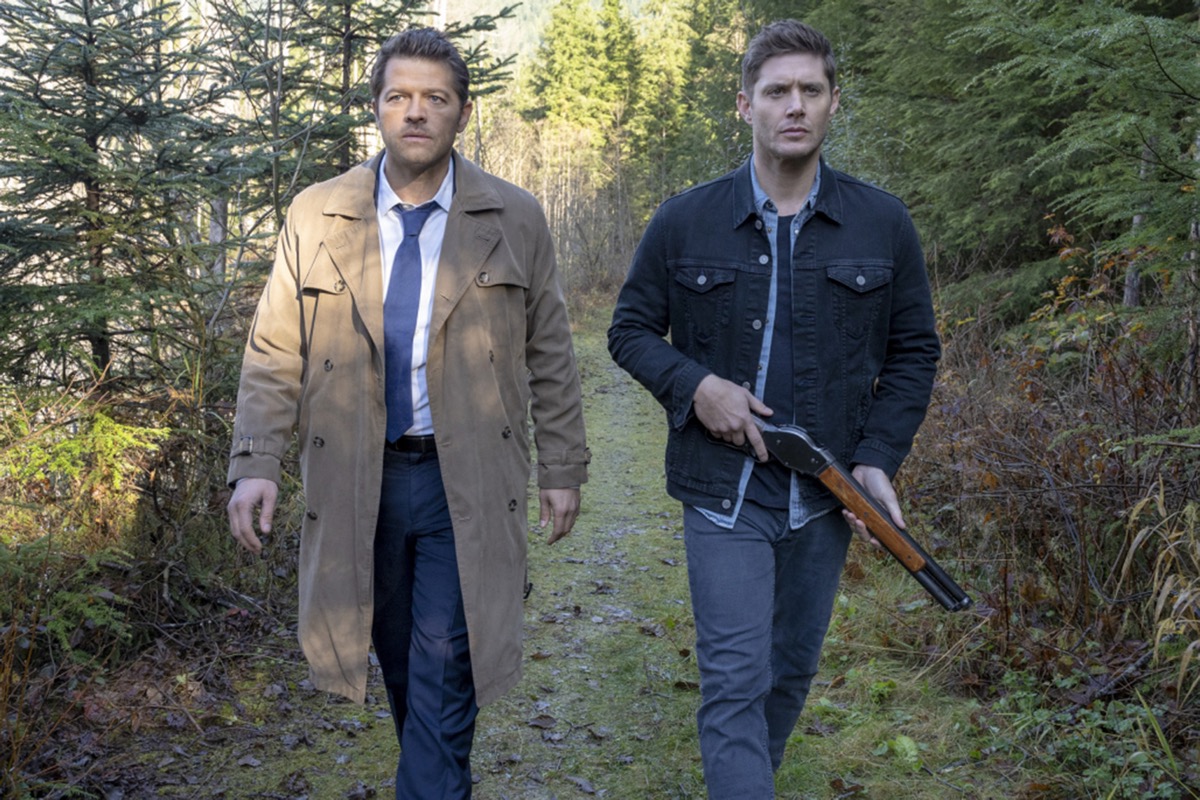 An angel and a man walk thorugh the woods in Supernatural