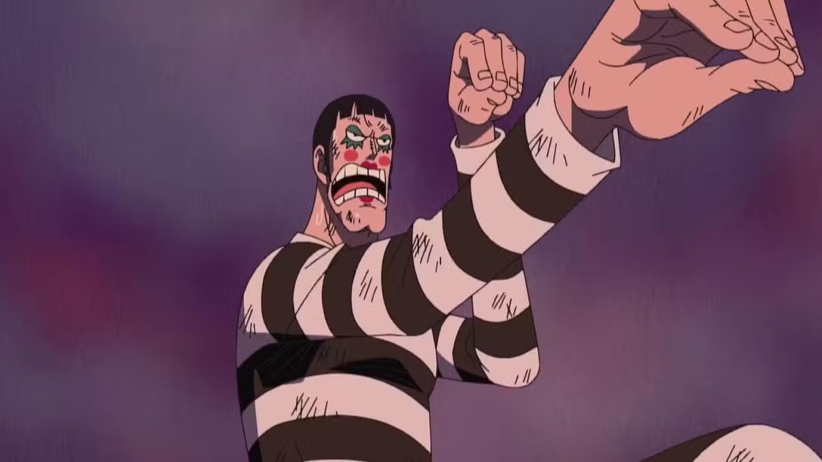 Bon Clay in a prison uniform stands ready to fight in One Piece