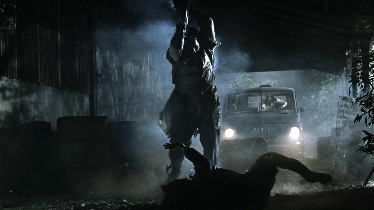Leatherface prepares to kill a helpless man in The Texas Chainsaw Massacre