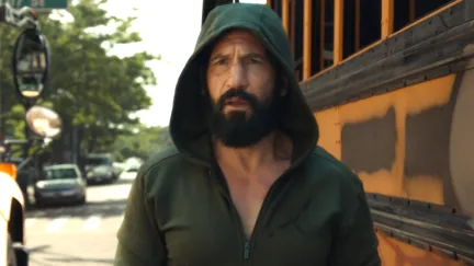 man walking with a hoodie on