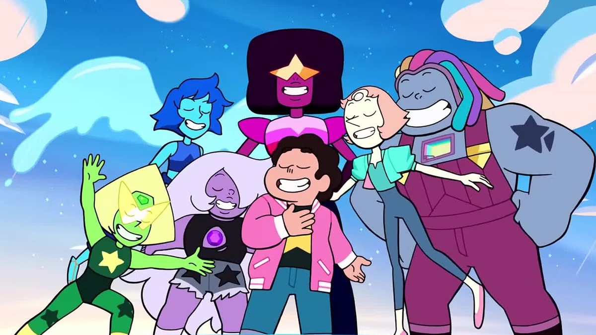 The Steven Universe cast smiles and stands together on a hilltop