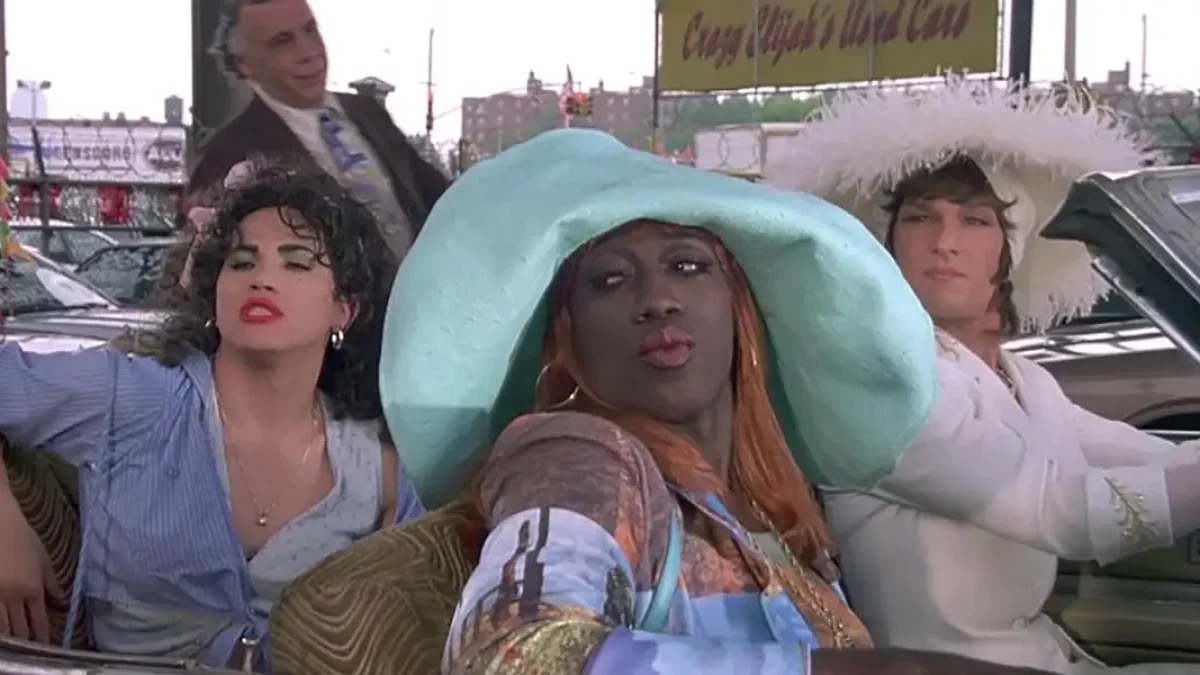 Three drag performers cast shade out of a convertible in To Wong Foo