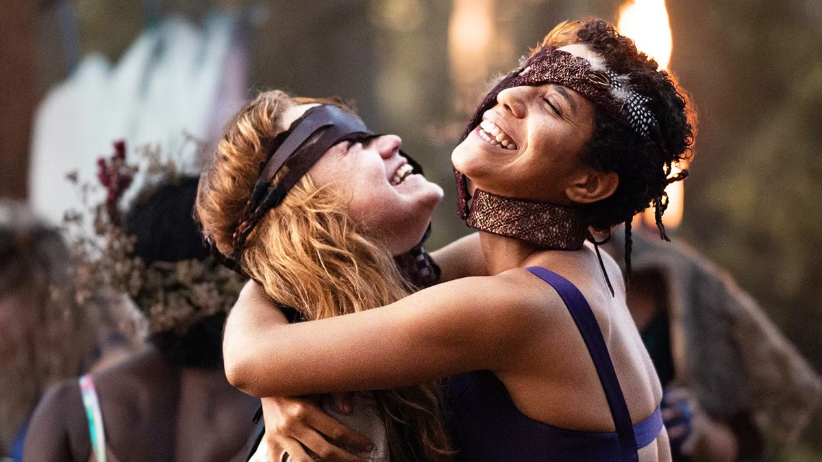 Two women smile and hold each other in Yellowjackets
