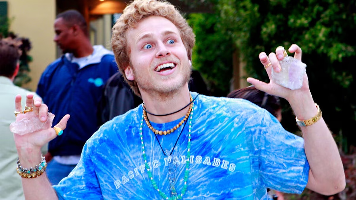 man holding crystals