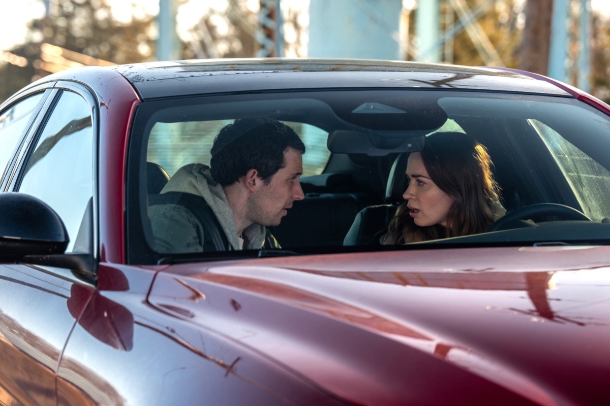 two people sitting in a car