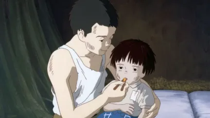 A young boy nurses a sick little girl in Grave of the Fireflies