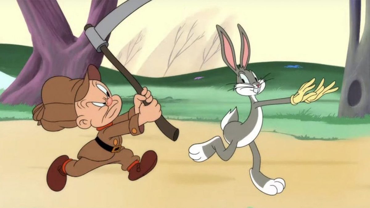 Bugs Bunny gleefully flees from Elmer Fudd in Looney Tunes