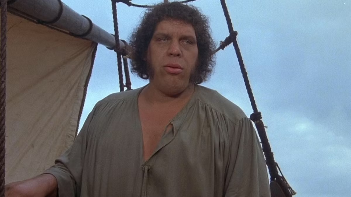 Fezzik stands on a sail boat in The Princess Bride