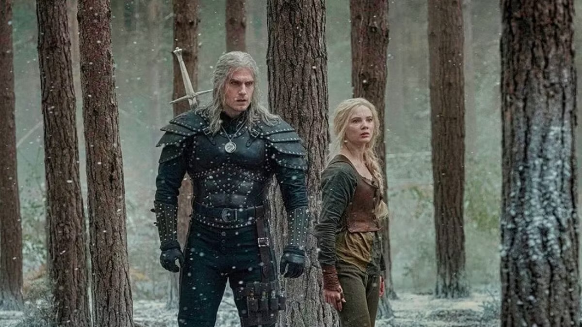 Geralt and Ciri stand in the woods in The Witcher