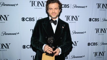 man holding an award