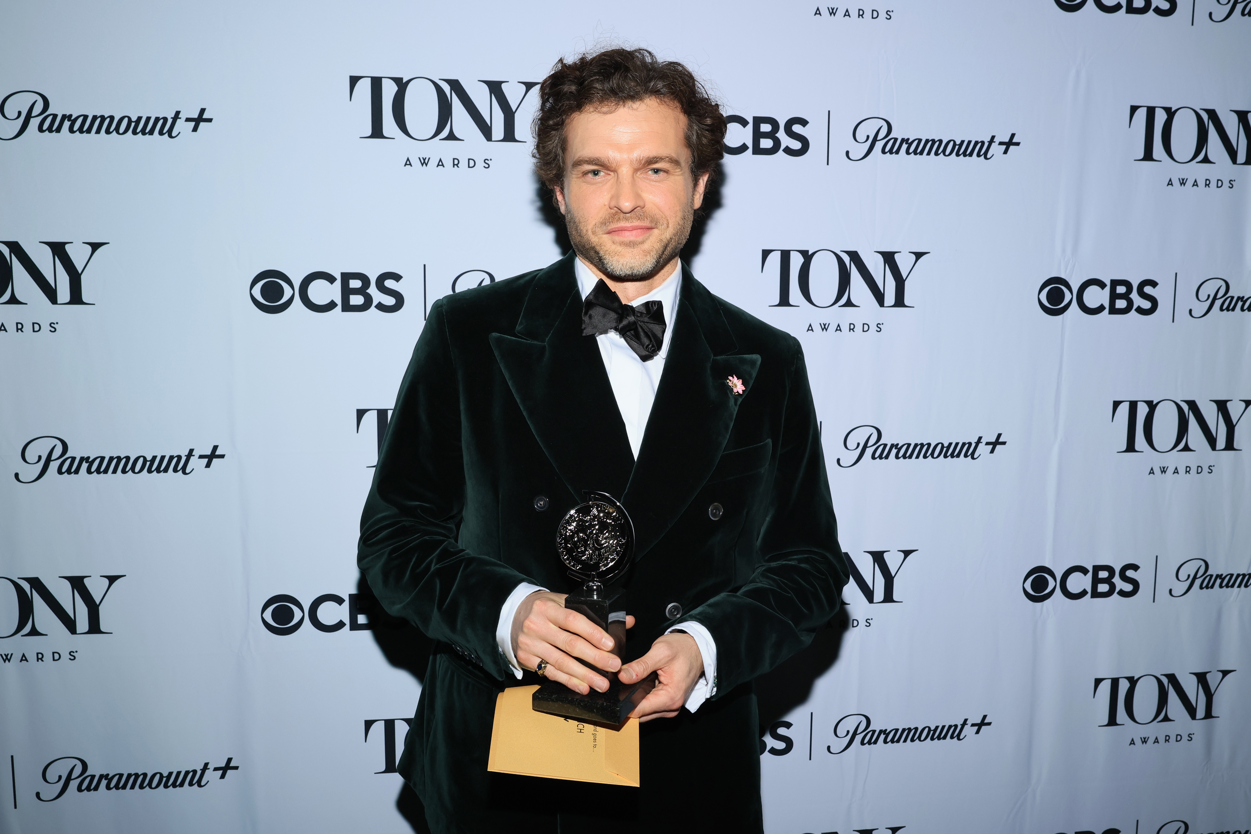 man holding an award