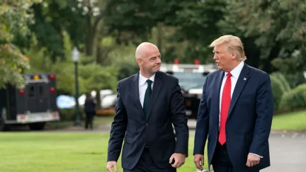Gianni Infantino and Donald Trump walking together