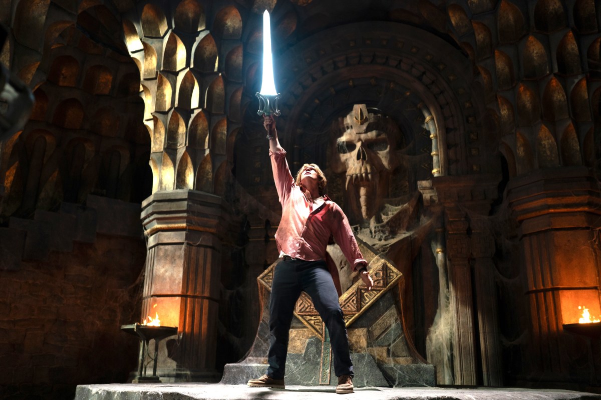 man standing with sword