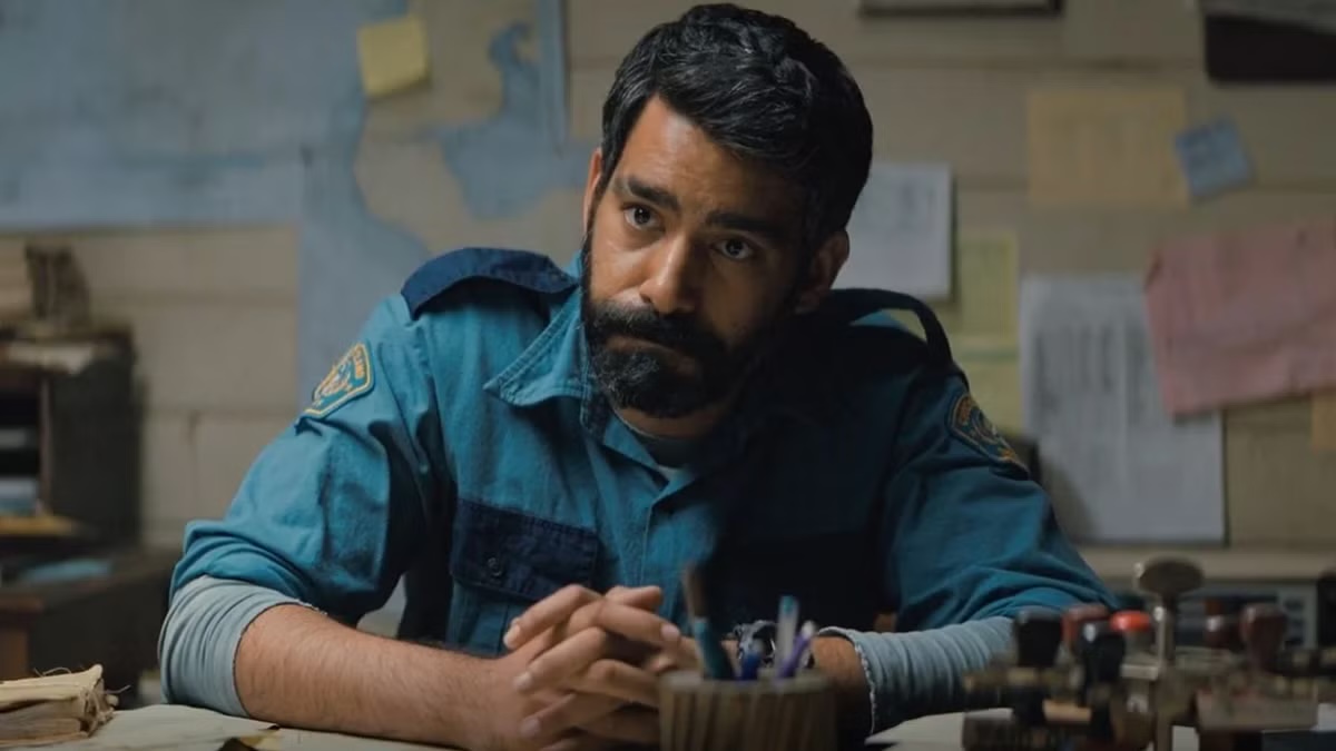 Sheriff Hassan looks over his desk in Midnight Mass