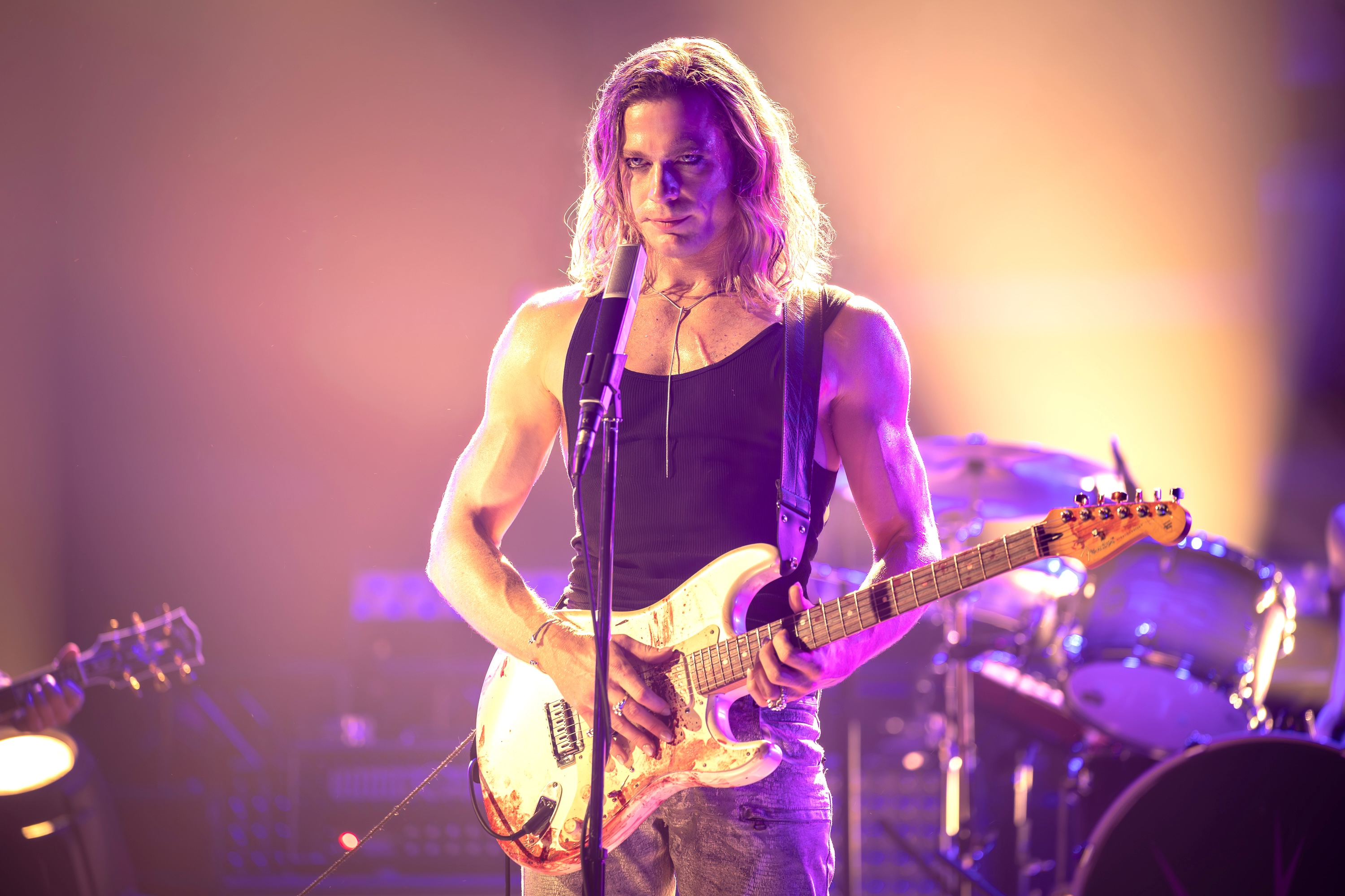 man holding guitar